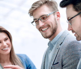 Professionals reviewing health plan options together, comparing ACA vs private health insurance differences.