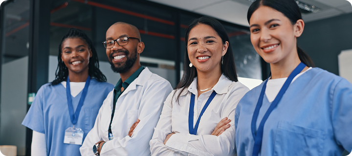 Doctors, group and happy with arms crossed in hospital with confidence in medical goals or mission. Healthcare, team and portrait of people in clinic working in medicare with pride and diversity.