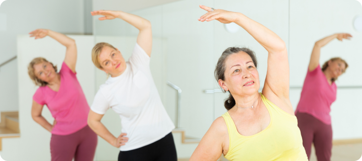 Active mature women enjoying training in dance studio, dance class for adults